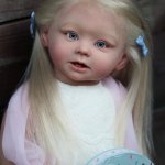 Девочка реборн с пионом