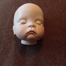 Головка-реплика спящего малыша
