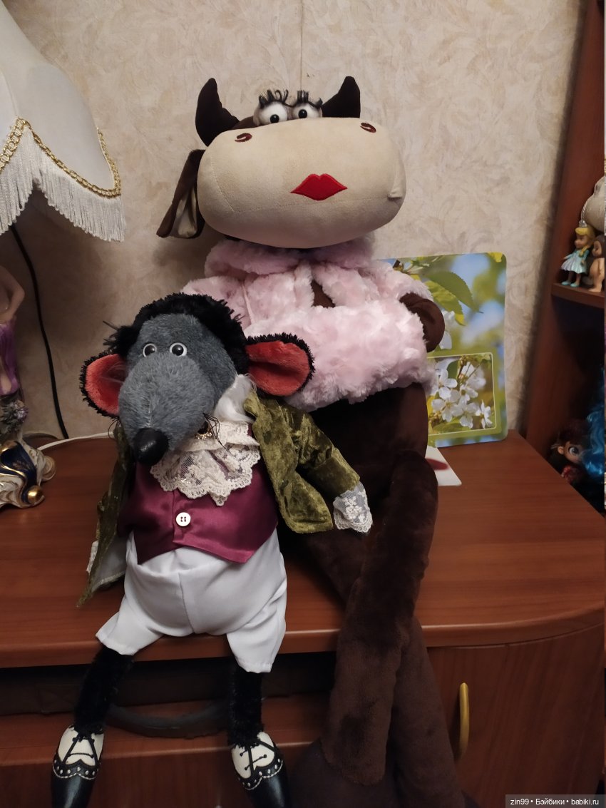 корова