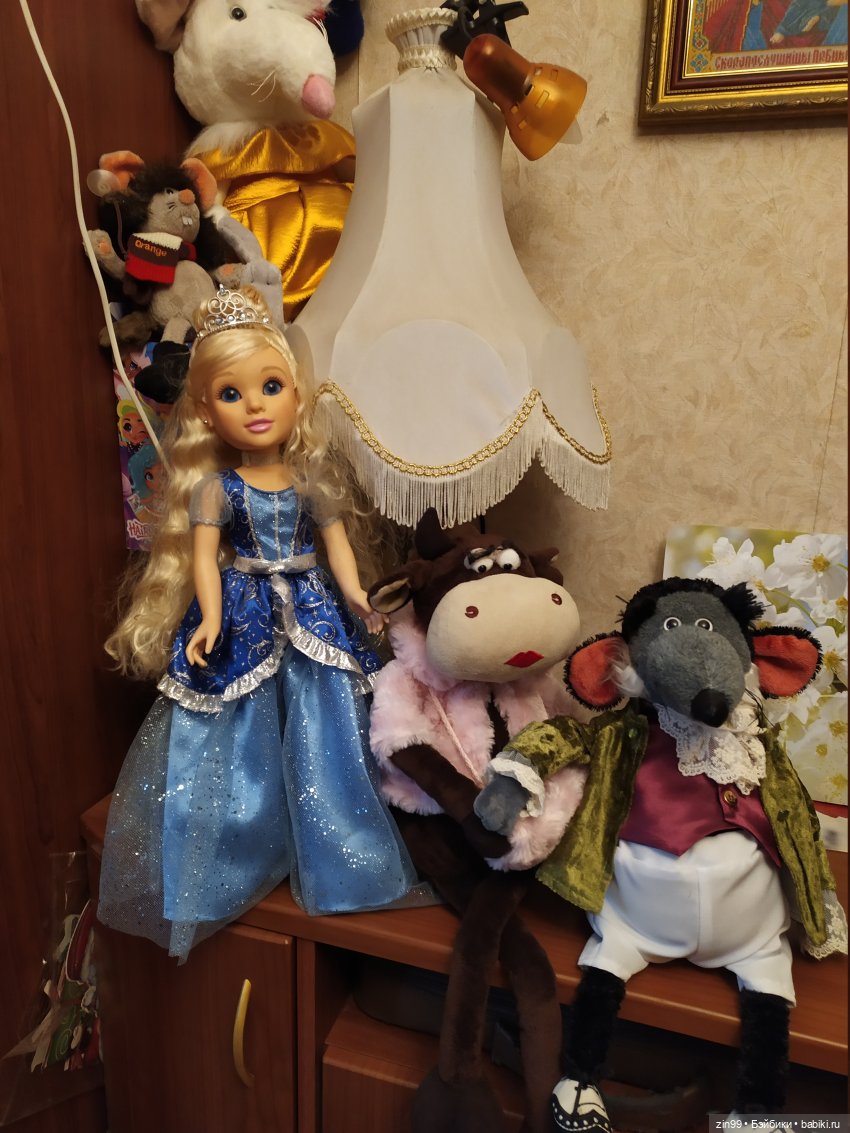 корова