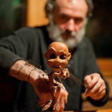 Куклы на запястье Владимира Захарова