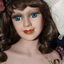Фарфоровая кукла с красивым лицом 60 см