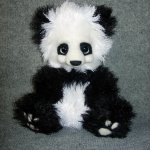 Панда, игрушка вязанная спицами