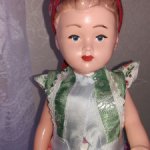 Сувенирная кукла в многослойном национальном костюме