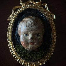 Антикварная голова в раме
