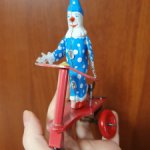 Винтажный заводной клоун на самокате. Репро.