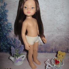 Яркая Мали от Паола Рейна с каштановыми волосами и голубыми глазами