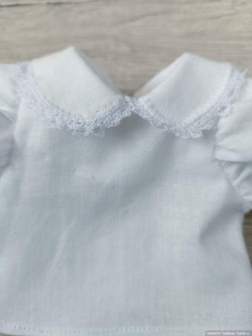 Белые блузочки снова в топе (фото 5)