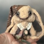 Зайчик с телефоном Ани Колыхаловой