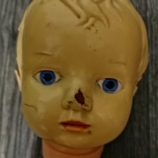 Целлулоидная кукла после реставрации