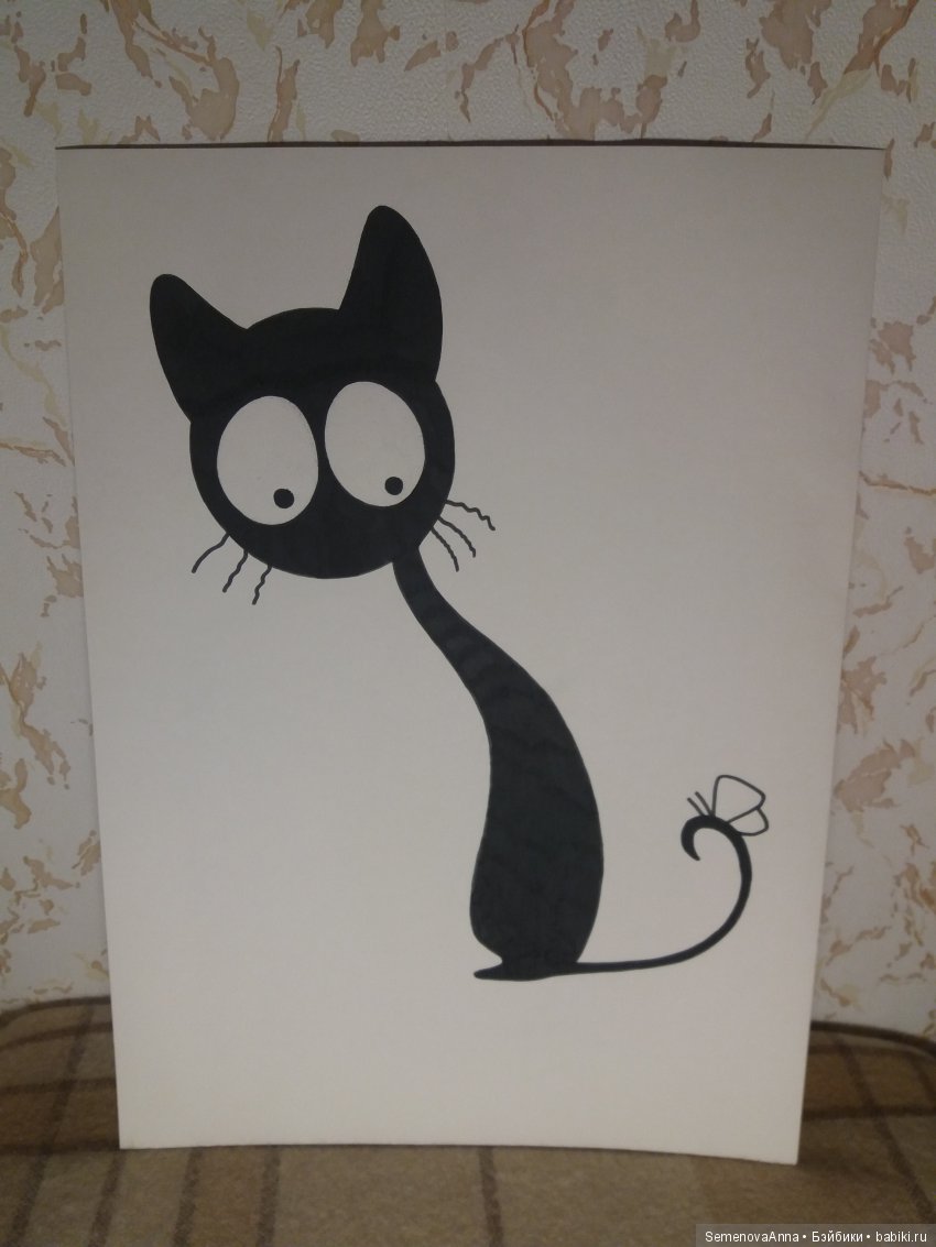 Чёрная кошка бежала по дорожке