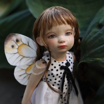 Трогательная бабочка из дерева.