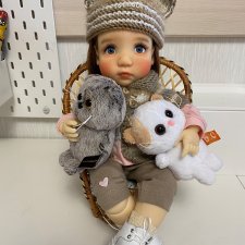 Три пушистых маленьких котенка