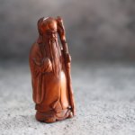 Нэцкэ "Бог счастья с персиком"