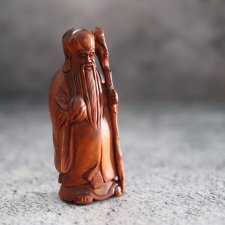 Нэцкэ "Бог счастья с персиком"