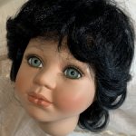 Голова фарфоровой куколки с париком