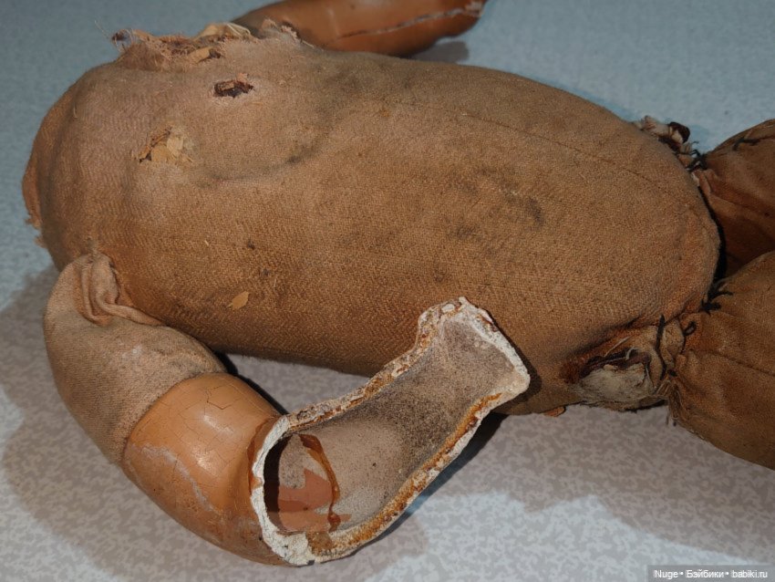 Тело старой куклы