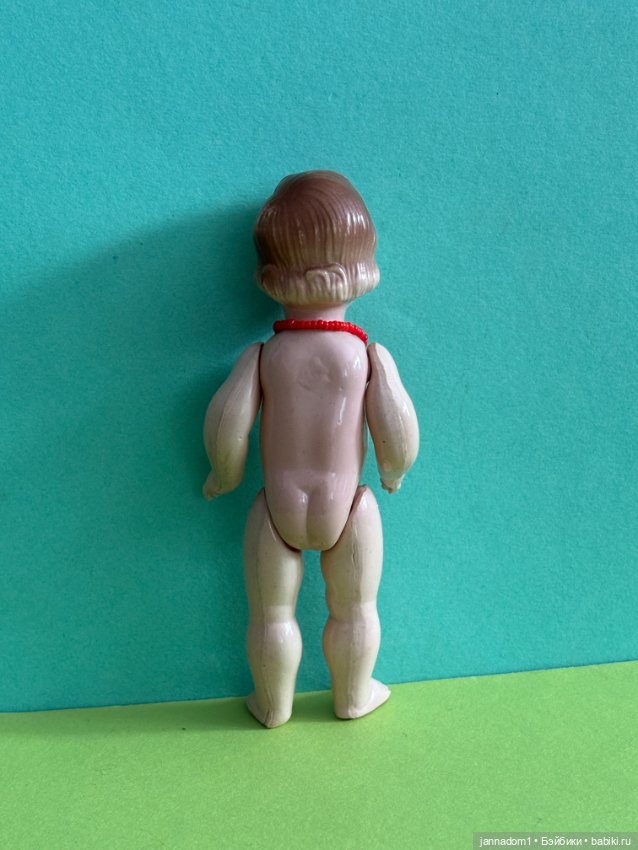 Целлулоидная куколка с рельефными волосами, высота 13 см (фото 5)