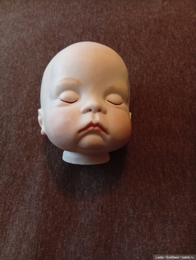 Головка-реплика спящего малыша