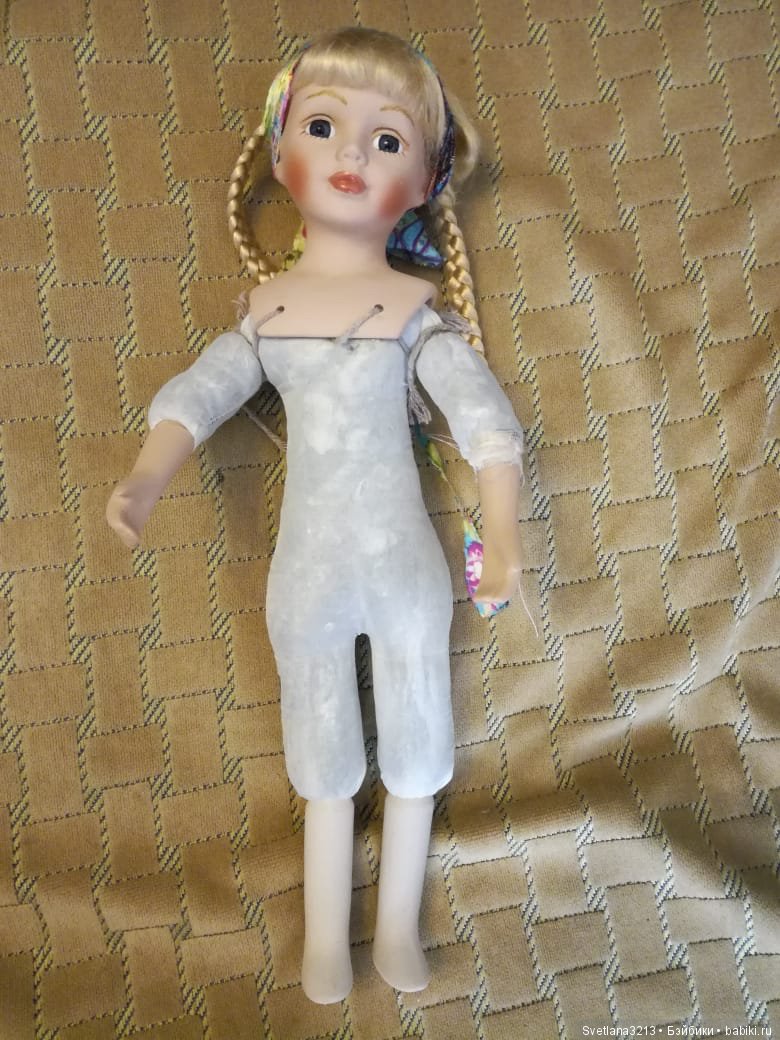 Фарфоровая кукла после реставрации