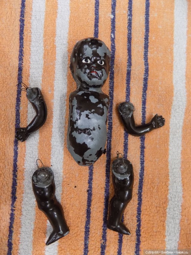 Реставрация двух тёмнокожих мальчиков. Один целлулоидный, второй металлический