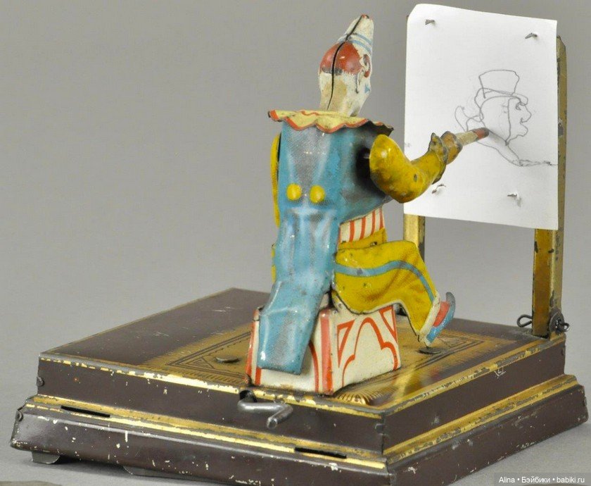 Механическая игрушка - художник